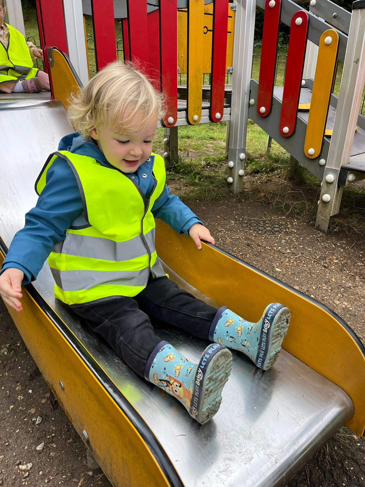 Image of a child on a slide.